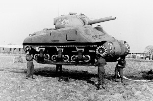 Men lifting tanks